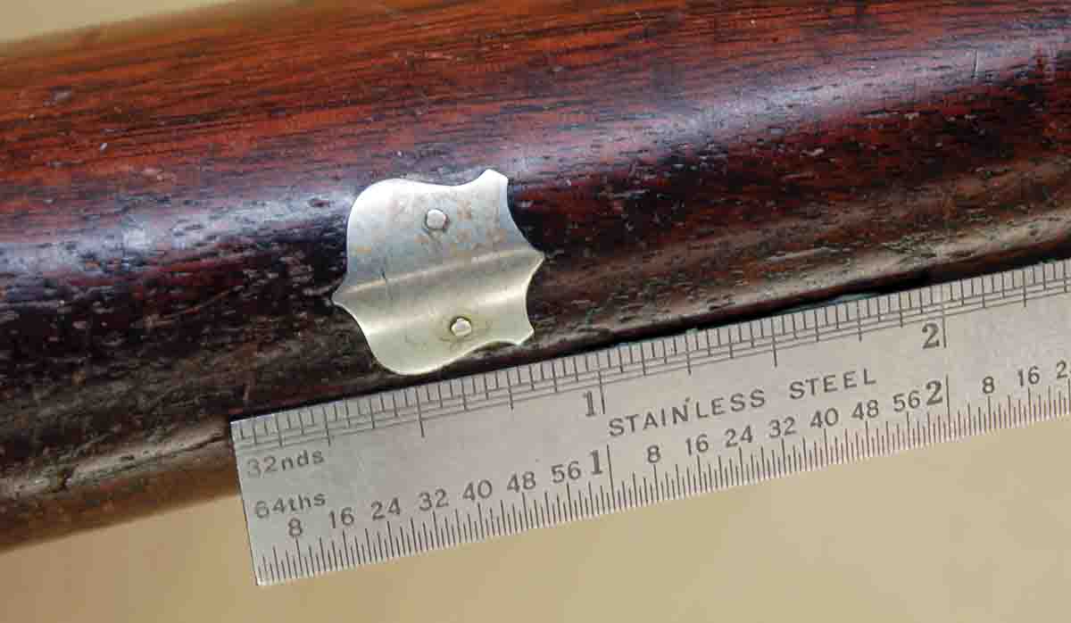 An initial shield in a Parker double is held in place by two tiny nails, which have worked loose.